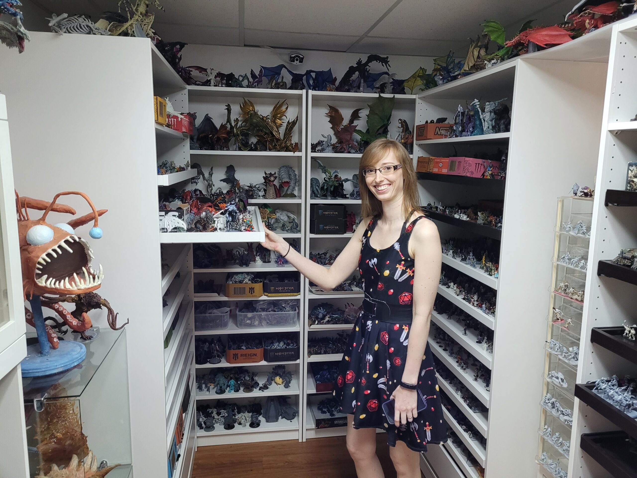 Jodene shows off a small portion of the tabletop gaming library of over thirty thousand miniatures and accessories available to patrons!